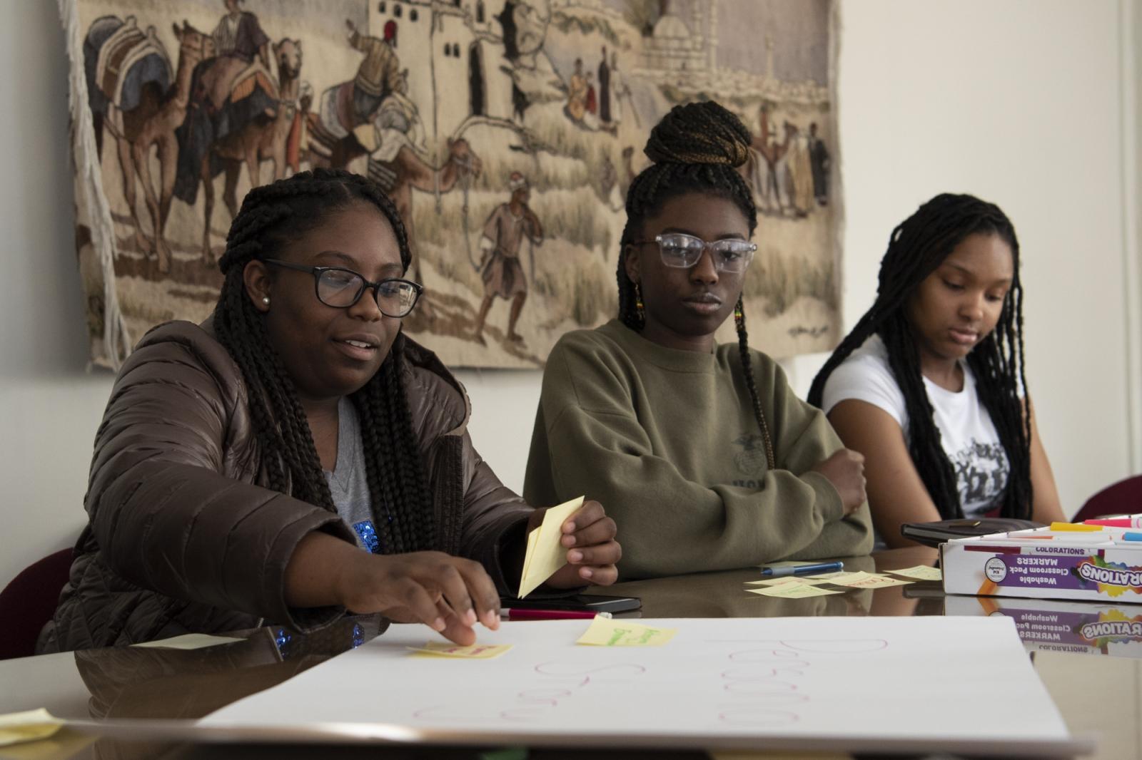 Three students working on a project